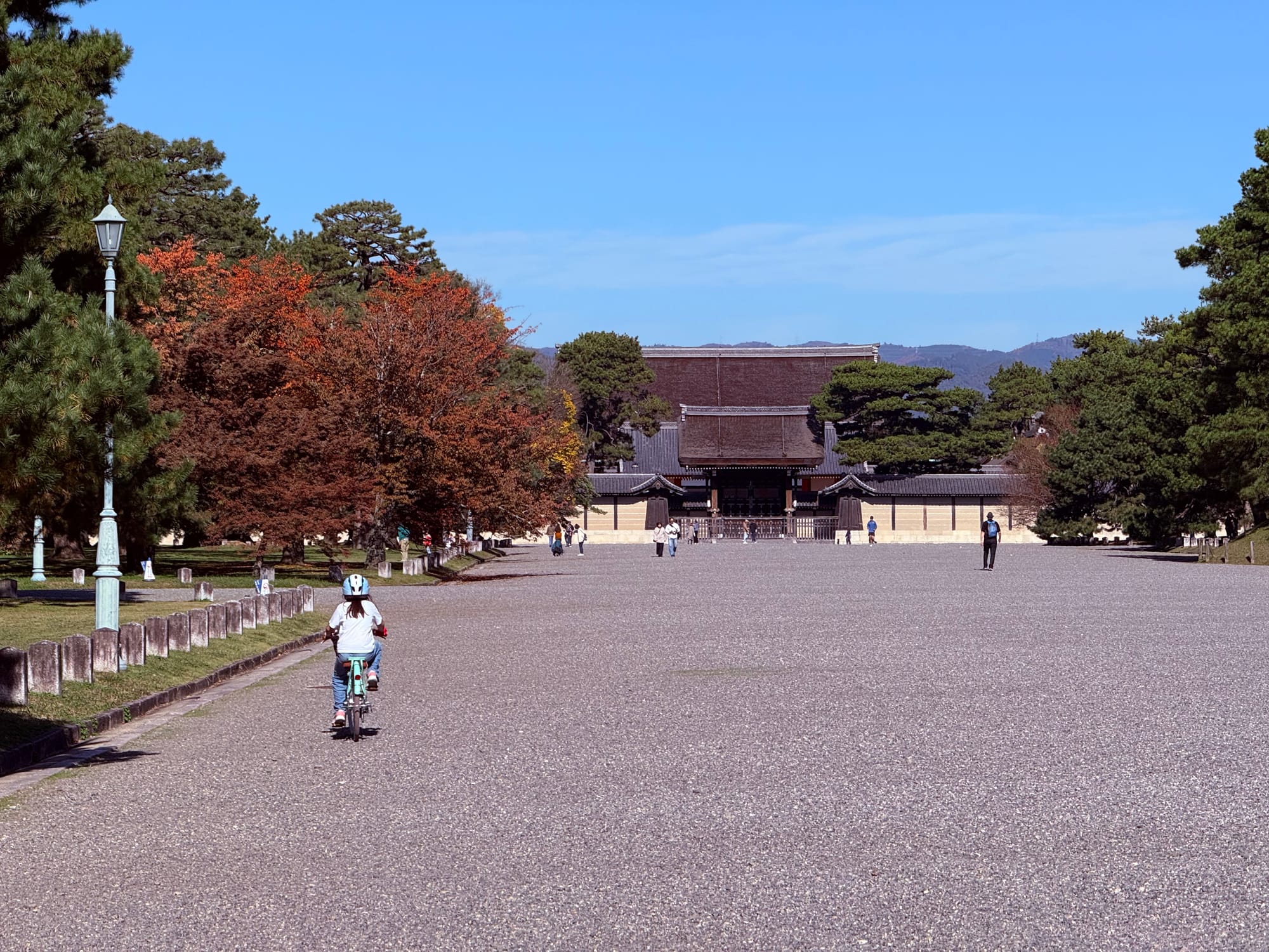 Our daughter riding her bike at Kyoto Gyoen, home of the Kyoto Imperial Palace